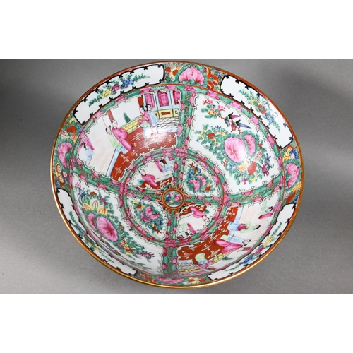 514 - A 20th century Chinese famille rose punch bowl painted with figures, flowers and birds in alternatin... 