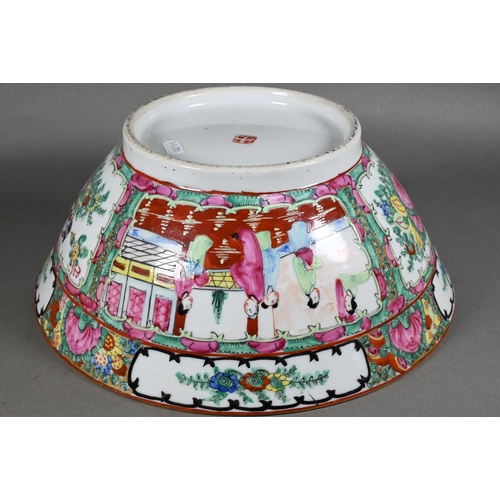 514 - A 20th century Chinese famille rose punch bowl painted with figures, flowers and birds in alternatin... 