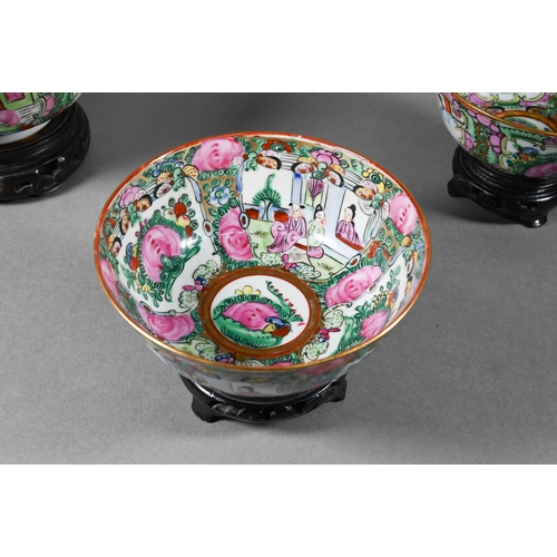 514 - A 20th century Chinese famille rose punch bowl painted with figures, flowers and birds in alternatin... 