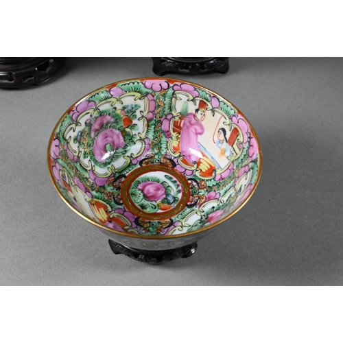 514 - A 20th century Chinese famille rose punch bowl painted with figures, flowers and birds in alternatin... 