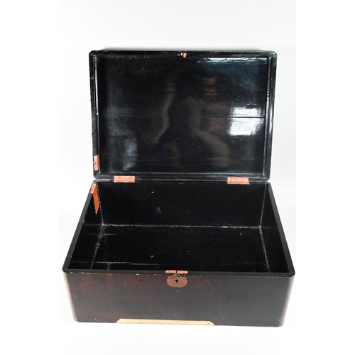 516 - An early 20th century Japanese black lacquered box with hinged cover decorated with birds and flower... 