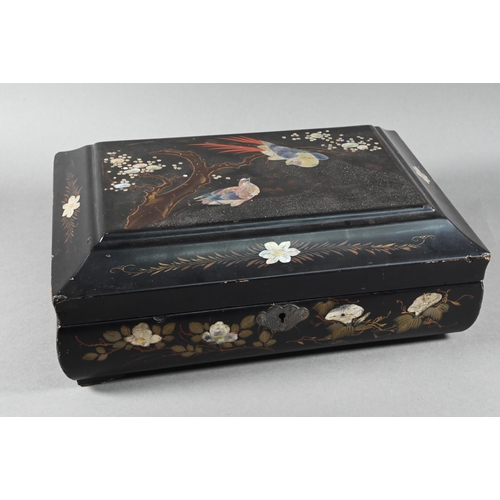 516 - An early 20th century Japanese black lacquered box with hinged cover decorated with birds and flower... 