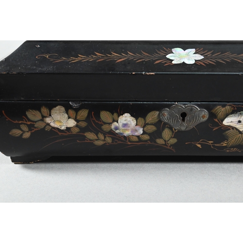 516 - An early 20th century Japanese black lacquered box with hinged cover decorated with birds and flower... 