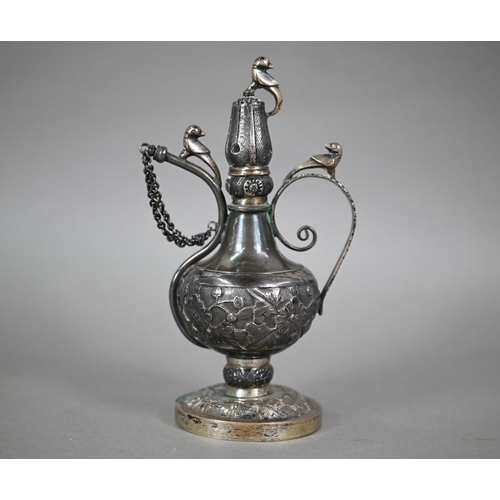 525 - Description Amendment- An North Indian Mughal silver rosewater ewer surmounted by birds, with scroll... 