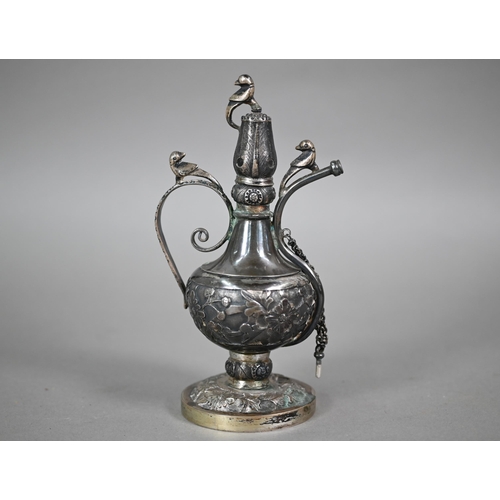 525 - Description Amendment- An North Indian Mughal silver rosewater ewer surmounted by birds, with scroll... 