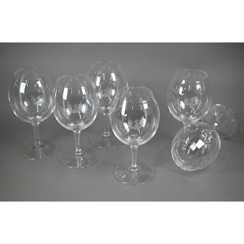 530 - A set of six large and good quality wine-glasses, etched with gryphon crests, on octagonal-cut slend... 