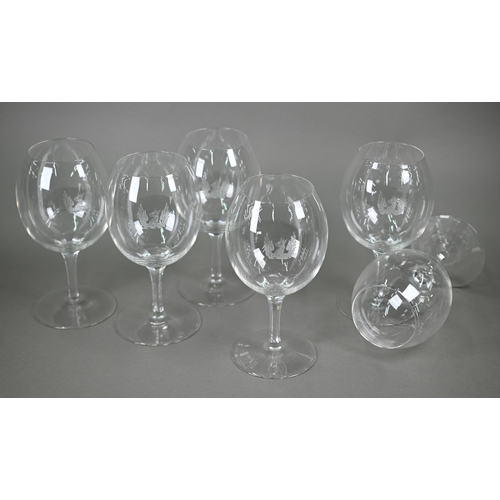 530 - A set of six large and good quality wine-glasses, etched with gryphon crests, on octagonal-cut slend... 