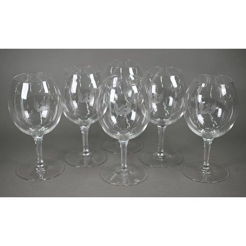 530 - A set of six large and good quality wine-glasses, etched with gryphon crests, on octagonal-cut slend... 