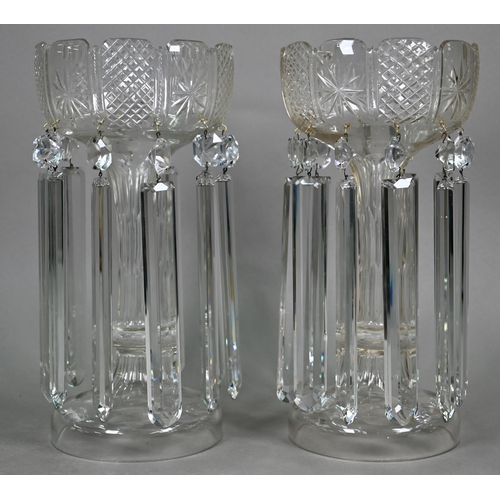 535 - A large pair of cut glass vases, hung with facetted beads and lustres, on hollow knop stems with dom... 