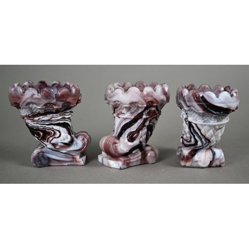 539 - A matched pair of 19th century unmarked slag glass shell vases on rectangular bases, 10 cm high to/w... 