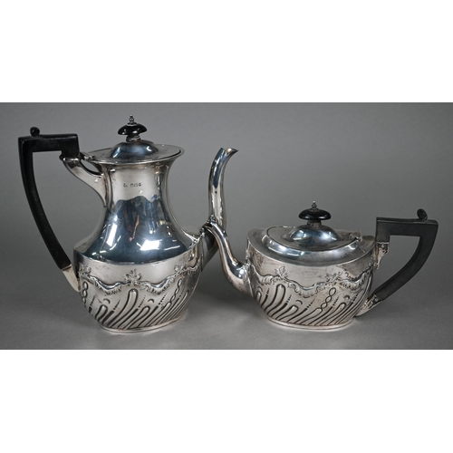 54 - A late Victorian silver tea pot and coffee pot with composite handles and ebonised finials, James De... 