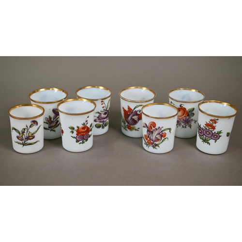 542 - A matched set of eight 19th century Continental opaque glass beakers, individually painted with flor... 