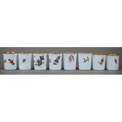 542 - A matched set of eight 19th century Continental opaque glass beakers, individually painted with flor... 