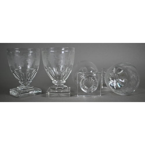 546 - A set of four Regency glass rummers with vine etched decoration on squat stems and heavy square star... 