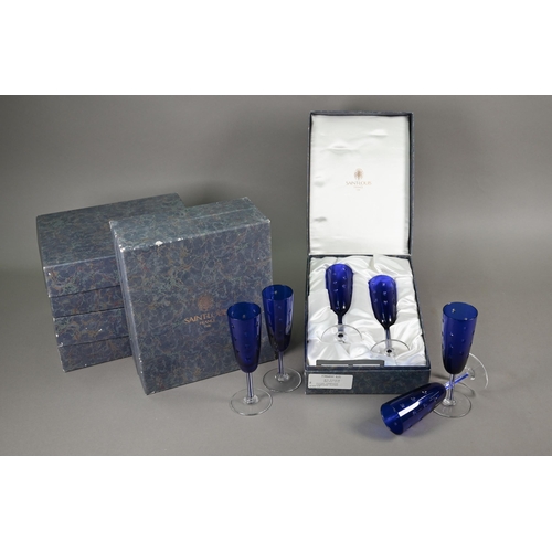 551 - Six boxed pairs of St Louis glass blue flash and star-cut champagne flutes (boxes a/f)