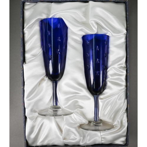 551 - Six boxed pairs of St Louis glass blue flash and star-cut champagne flutes (boxes a/f)