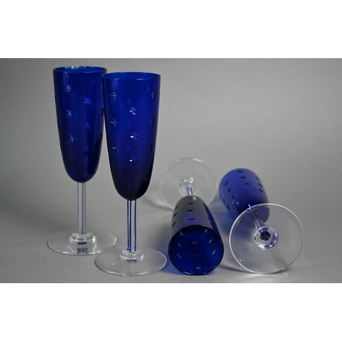 551 - Six boxed pairs of St Louis glass blue flash and star-cut champagne flutes (boxes a/f)