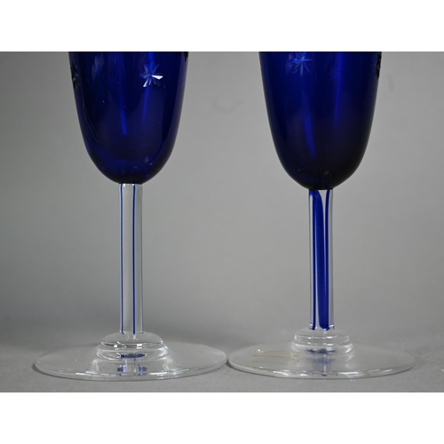 551 - Six boxed pairs of St Louis glass blue flash and star-cut champagne flutes (boxes a/f)