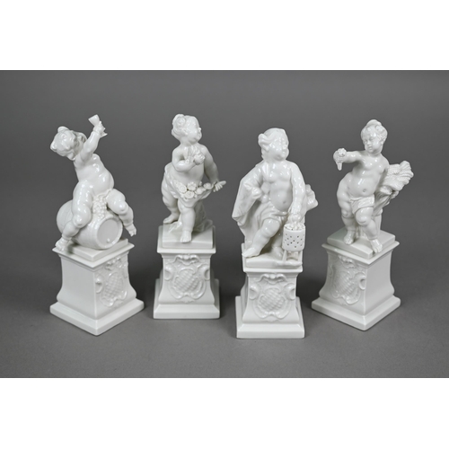 557 - A set of four Nymphenburg white-glazed putti on plinths - The Four Seasons, 17 cm high (4)