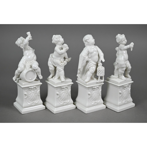 557 - A set of four Nymphenburg white-glazed putti on plinths - The Four Seasons, 17 cm high (4)