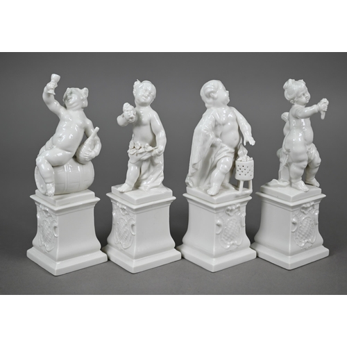 557 - A set of four Nymphenburg white-glazed putti on plinths - The Four Seasons, 17 cm high (4)