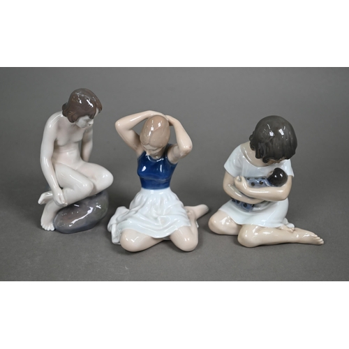 558 - Three Royal Copenhagen seated figures - 1938 Girl with Doll, 4027 Girl on Rock and 4648 dancer fixin... 