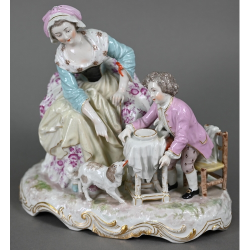 568 - A 19th century porcelain group, 18th century mother and child, the boy feeding scraps to a small dog... 