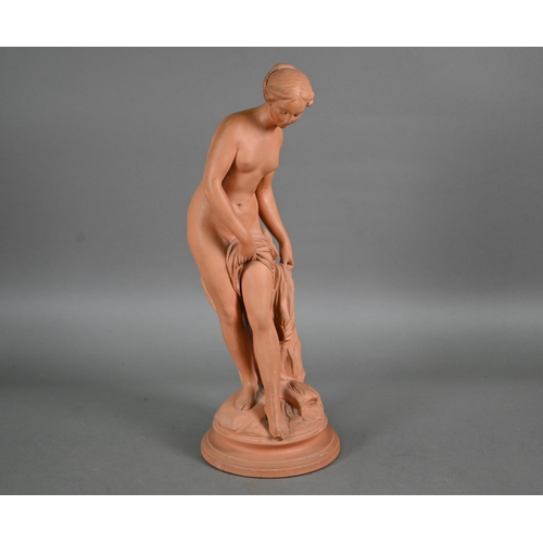 571 - A 19th century terracotta figure of a female nude, 42 cm on circular base (toe missing and chip on r... 