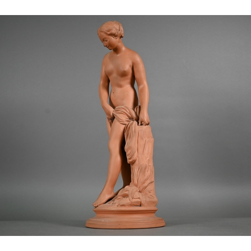 571 - A 19th century terracotta figure of a female nude, 42 cm on circular base (toe missing and chip on r... 