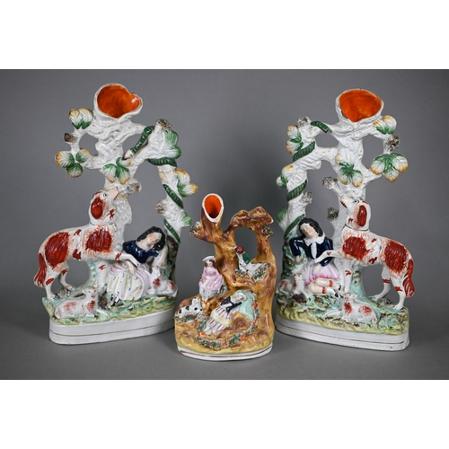 572 - A pair of Victorian Staffordshire pottery spill-vase groups, dog protecting sleeping children from a... 