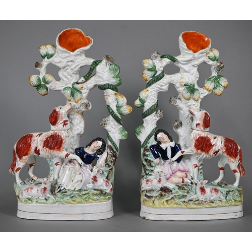 572 - A pair of Victorian Staffordshire pottery spill-vase groups, dog protecting sleeping children from a... 