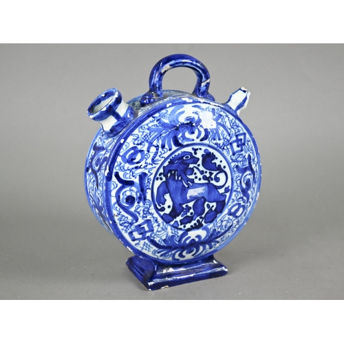 574 - A 19th century Continental blue and white tin-glazed chevrette (water-carrier) of moon-flask form, p... 