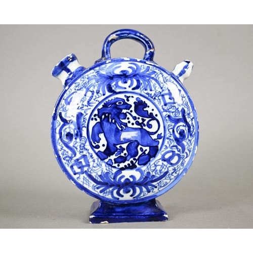 574 - A 19th century Continental blue and white tin-glazed chevrette (water-carrier) of moon-flask form, p... 