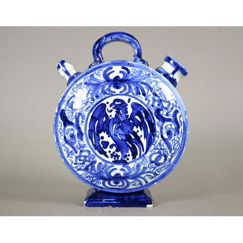 574 - A 19th century Continental blue and white tin-glazed chevrette (water-carrier) of moon-flask form, p... 