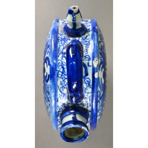 574 - A 19th century Continental blue and white tin-glazed chevrette (water-carrier) of moon-flask form, p... 