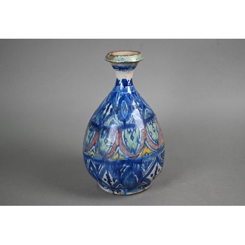 575 - A majolica pear-shaped vase with flared neck decorated in the Isnic manner in blue, green, red and y... 