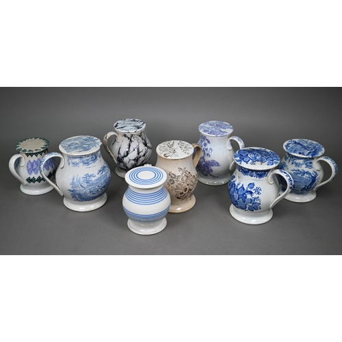 580 - Eight 19th century pottery treacle jars with screw tops, four with blue and white transfer-printed d... 