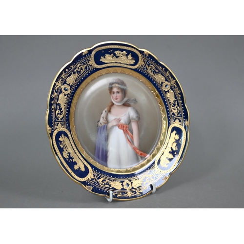 588 - A 19th century Vienna porcelain wall-plate painted with portraits of a lady, 'Luise', within a blue ... 