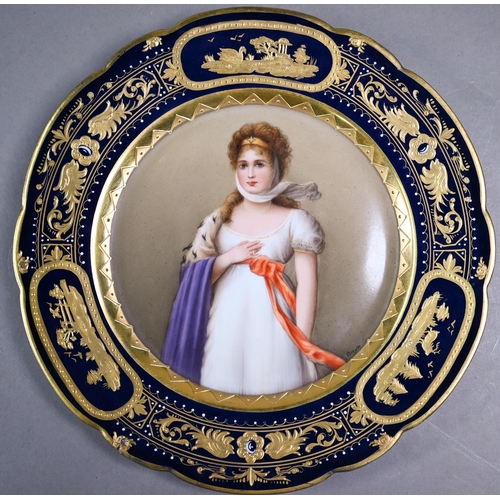 588 - A 19th century Vienna porcelain wall-plate painted with portraits of a lady, 'Luise', within a blue ... 