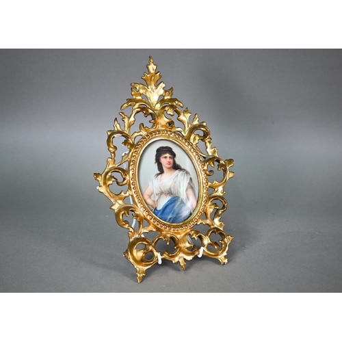 589 - A German porcelain oval plaque painted with Medea after Sichel, 12 x 9 cm, in ornate giltwood Floren... 