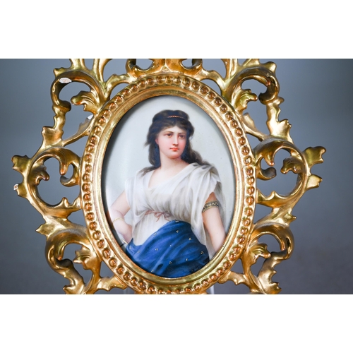 589 - A German porcelain oval plaque painted with Medea after Sichel, 12 x 9 cm, in ornate giltwood Floren... 