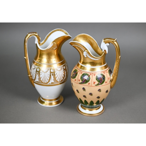 590 - Two Empire Period Paris porcelain gilded jugs of matching shape, with extensive gilding - one polych... 