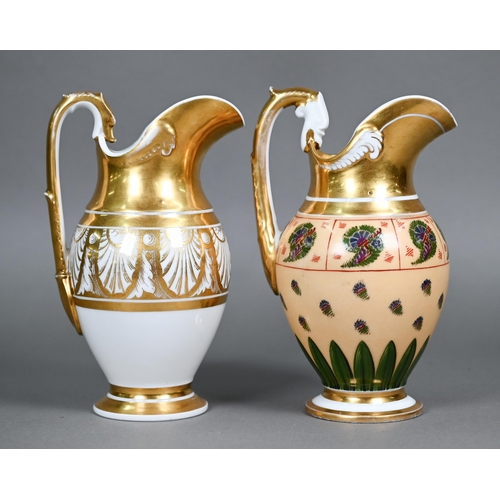 590 - Two Empire Period Paris porcelain gilded jugs of matching shape, with extensive gilding - one polych... 