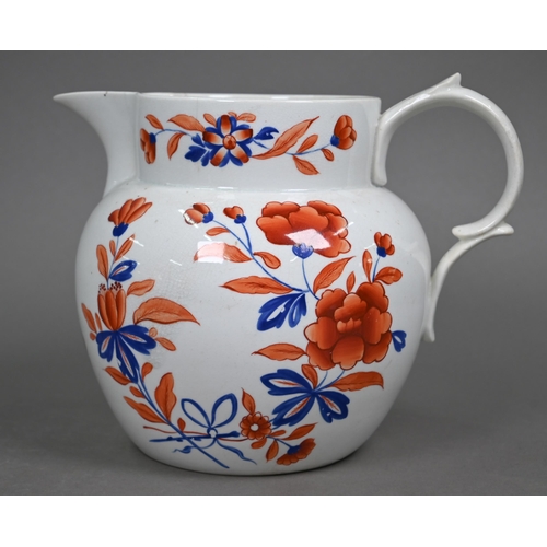 591 - An early 19th century stoneware large jug with floral painted decoration in iron red and blue enamel... 