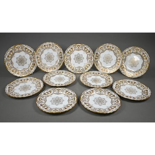 592 - A set of eleven Edwardian Coalport china 22.5 cm plates, finely gilded with cornucopiae, scrolls, fo... 