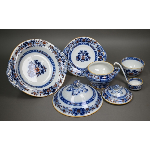 600 - A late Victorian Minton pottery dinner service, printed and painted with blue and iron-red floral de... 