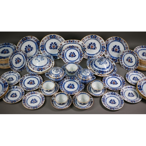 600 - A late Victorian Minton pottery dinner service, printed and painted with blue and iron-red floral de... 