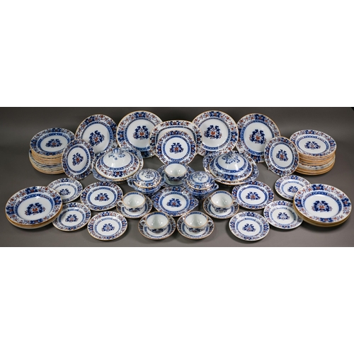 600 - A late Victorian Minton pottery dinner service, printed and painted with blue and iron-red floral de... 