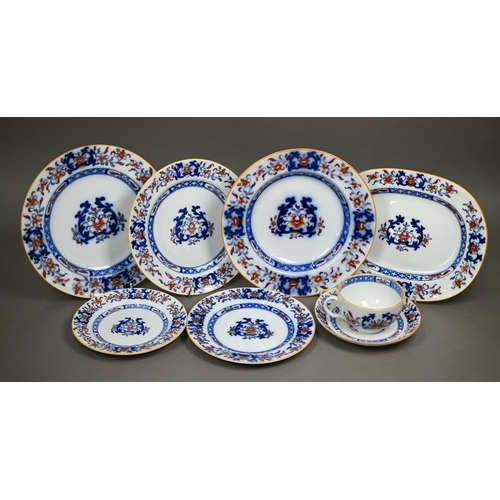 600 - A late Victorian Minton pottery dinner service, printed and painted with blue and iron-red floral de... 