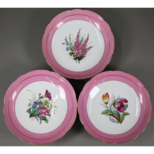 601 - A Victorian china fruit service with floral specimen painted centres with pink and gilt borders, com... 